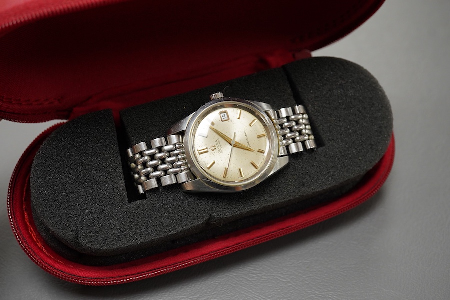 A gentleman's 1964 stainless steel Omega Seamaster Automatic wrist watch, with baton numerals and date aperture, movement 562, case diameter 35mm, on a stainless steel Omega bracelet, with Omega zip up pouch, no papers.